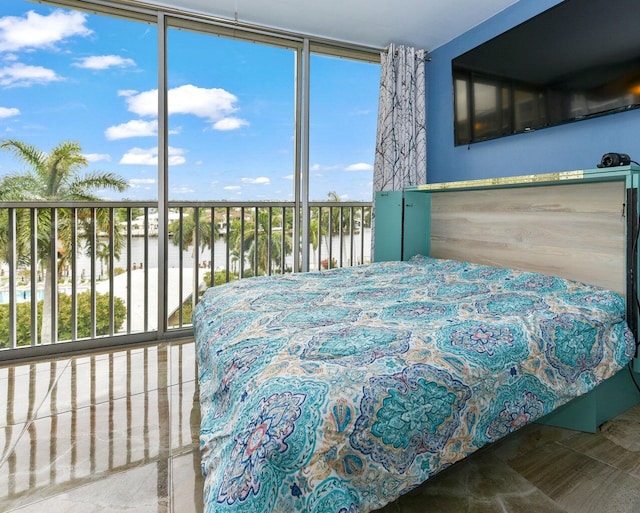 bedroom featuring multiple windows