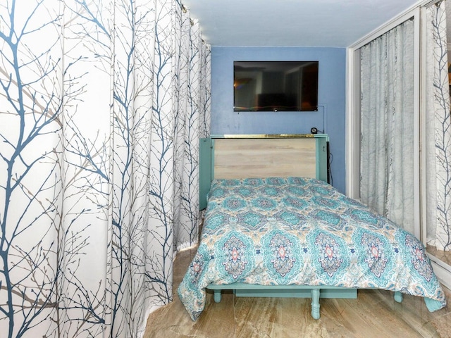 bedroom featuring hardwood / wood-style flooring