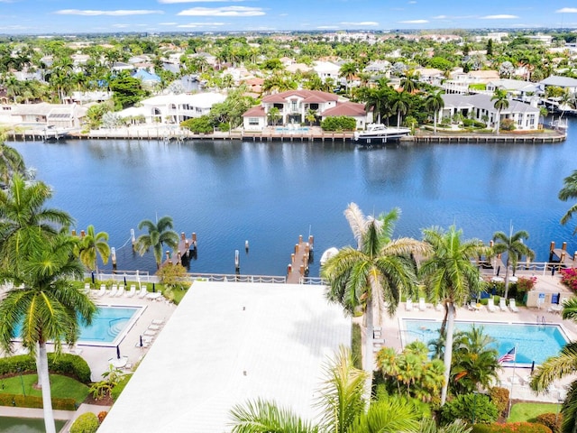 birds eye view of property featuring a water view