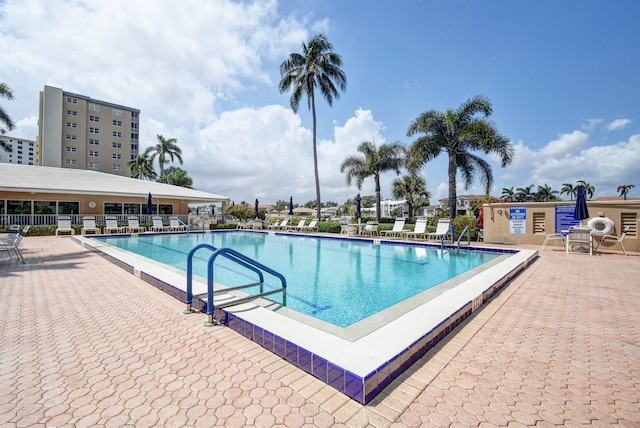 view of swimming pool with a patio area