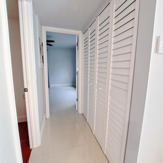 corridor featuring light tile patterned floors