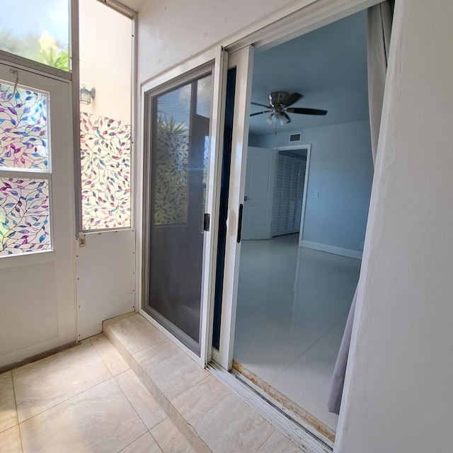 interior space featuring ceiling fan