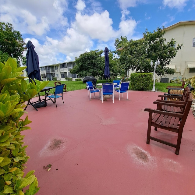 view of patio featuring a grill