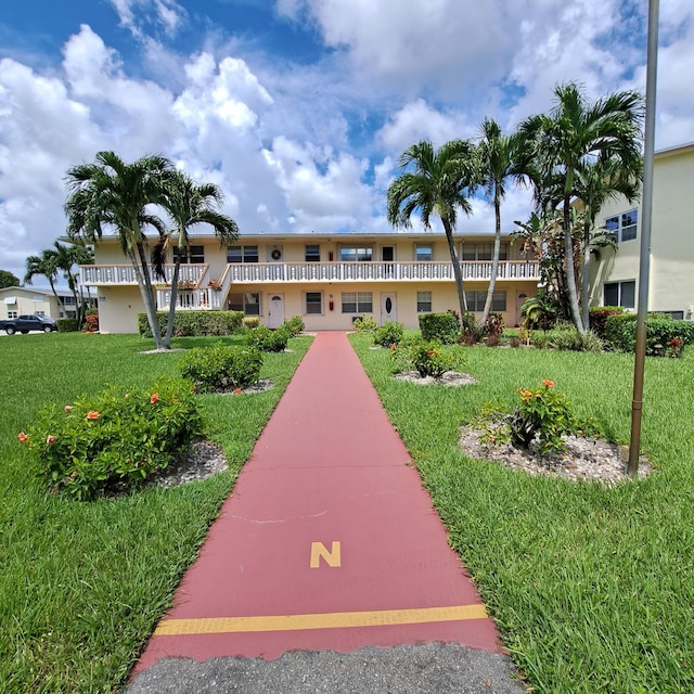 view of community featuring a lawn