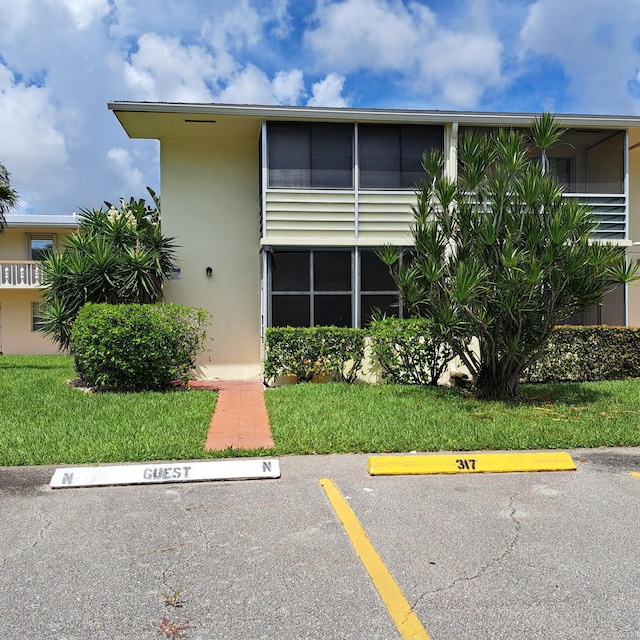 view of front of property with a front lawn