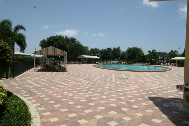 view of pool featuring a patio area and a gazebo