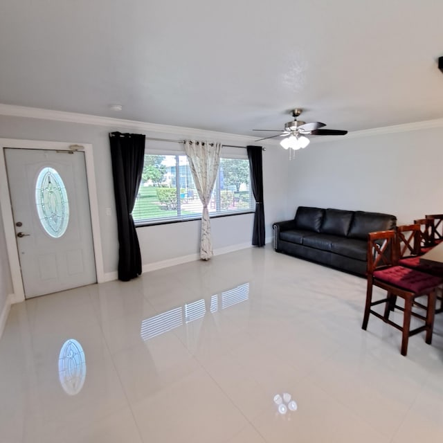 living room featuring ceiling fan, light tile patterned flooring, and ornamental molding