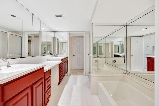 bathroom with vanity, shower with separate bathtub, and tile patterned flooring