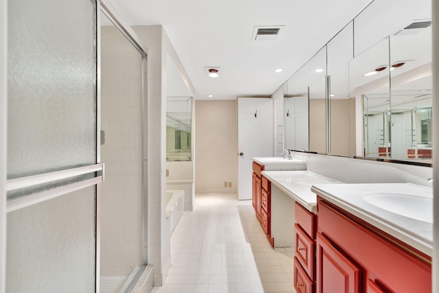 bathroom featuring vanity, tile patterned floors, and plus walk in shower