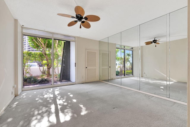 interior space featuring ceiling fan