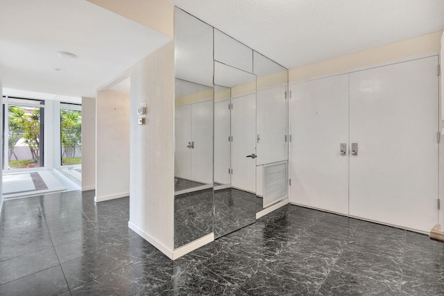 interior space with a textured ceiling