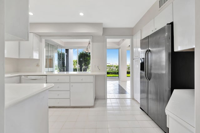 kitchen featuring white cabinets, dishwasher, light tile patterned floors, and stainless steel fridge with ice dispenser