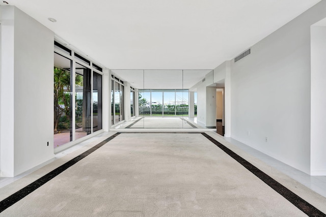 interior space featuring a wall of windows