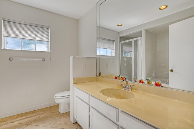 bathroom featuring vanity, toilet, and tile patterned flooring