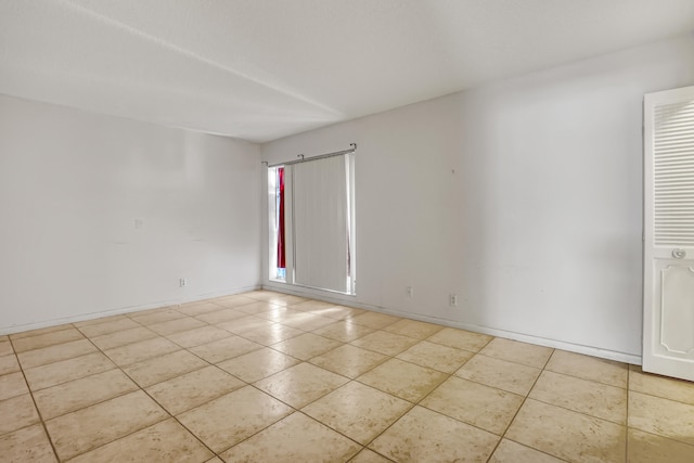 view of tiled spare room