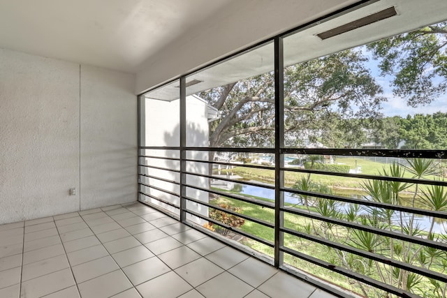 unfurnished sunroom with a wealth of natural light