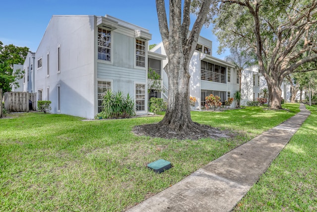 view of front of home with a front lawn