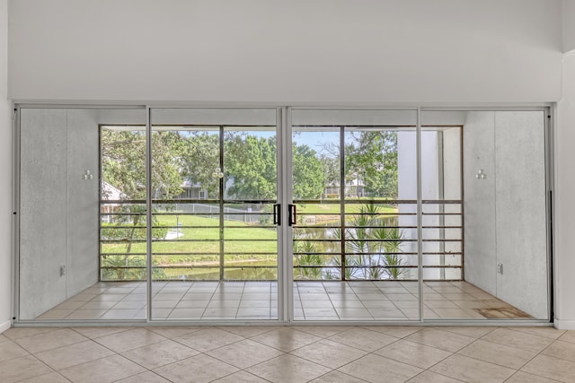 unfurnished room with light tile patterned flooring