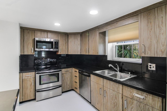 3475 S Ocean Blvd Unit 2160, Palm Beach, FL 33480 - kitchen featuring stainless steel appliances, a sink, tasteful backsplash, dark countertops, and recessed lighting