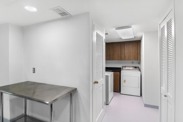 3475 S Ocean Blvd Unit 2160, Palm Beach, FL 33480 - laundry area featuring cabinet space, washing machine and dryer, and baseboards