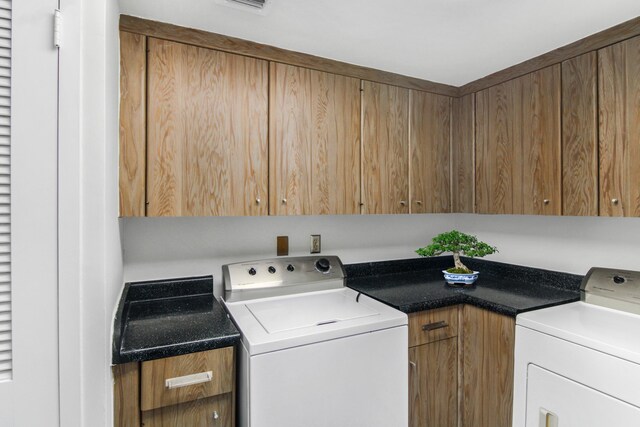 3475 S Ocean Blvd Unit 2160, Palm Beach, FL 33480 - laundry room with cabinet space and washer and dryer