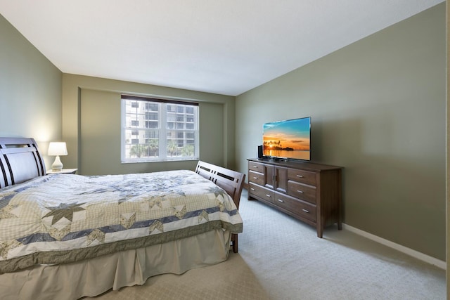 bedroom with carpet and baseboards