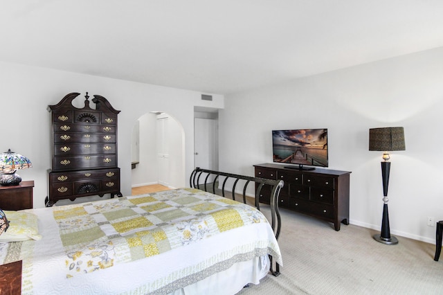 3475 S Ocean Blvd Unit 2160, Palm Beach, FL 33480 - bedroom with arched walkways, light carpet, and baseboards
