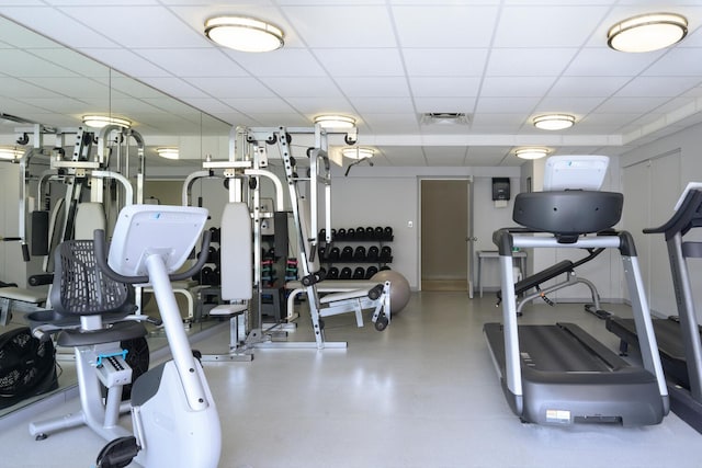 exercise room featuring a drop ceiling and visible vents