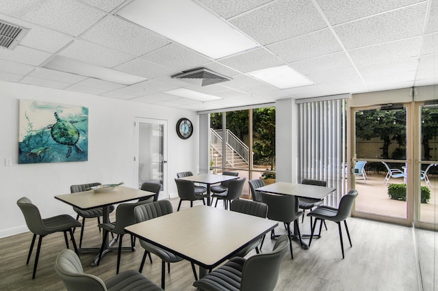 3475 S Ocean Blvd Unit 2160, Palm Beach, FL 33480 - dining space with light wood finished floors, a paneled ceiling, and baseboards