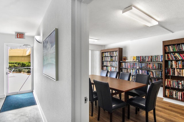 3475 S Ocean Blvd Unit 2160, Palm Beach, FL 33480 - dining room with a textured wall, baseboards, and a textured ceiling