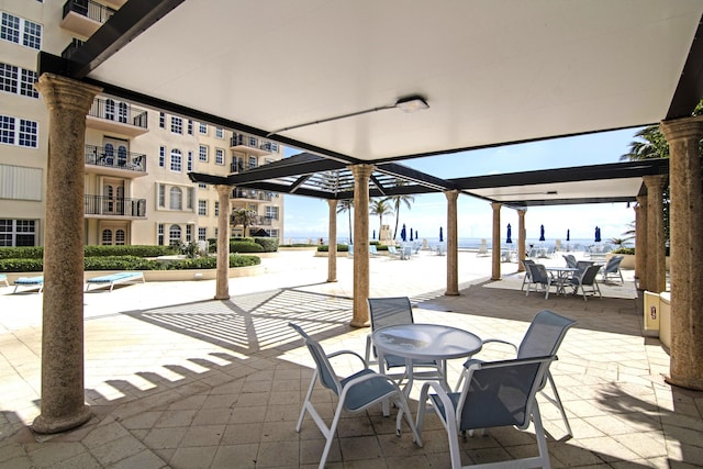 3475 S Ocean Blvd Unit 2160, Palm Beach, FL 33480 - view of patio / terrace with outdoor dining space and a water view
