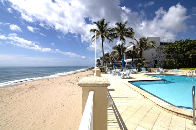 3475 S Ocean Blvd Unit 2160, Palm Beach, FL 33480 - community pool featuring a patio area and view of water and beach