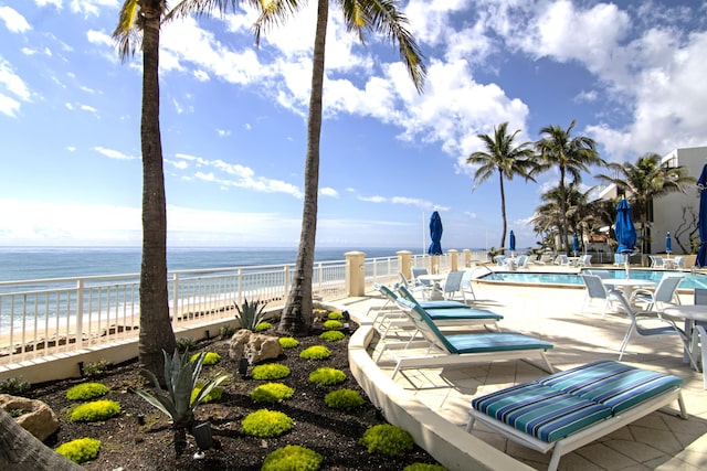 3475 S Ocean Blvd Unit 2160, Palm Beach, FL 33480 - view of patio / terrace with a community pool and view of water and beach