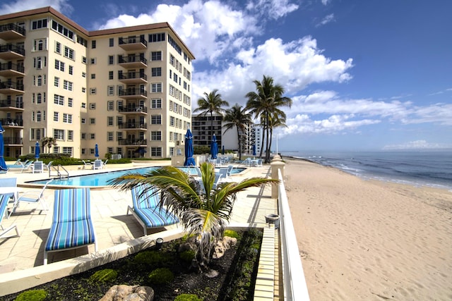 3475 S Ocean Blvd Unit 2160, Palm Beach, FL 33480 - community pool with view of water and beach and a patio area