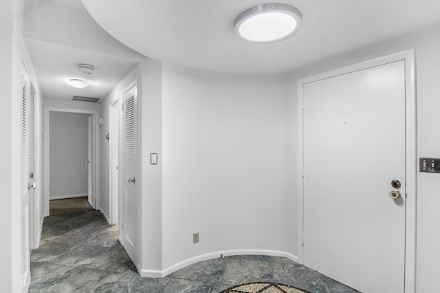 3475 S Ocean Blvd Unit 2160, Palm Beach, FL 33480 - entryway featuring stone finish floors and baseboards