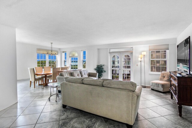3475 S Ocean Blvd Unit 2160, Palm Beach, FL 33480 - living area featuring a chandelier and tile patterned flooring