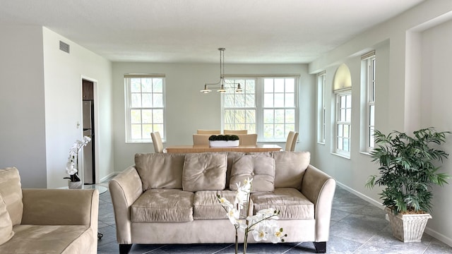 3475 S Ocean Blvd Unit 2160, Palm Beach, FL 33480 - living room featuring baseboards and tile patterned floors