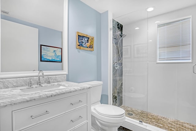 full bath with vanity, toilet, visible vents, and a stall shower