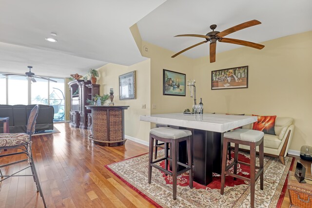 dining space featuring ceiling fan and light hardwood / wood-style flooring