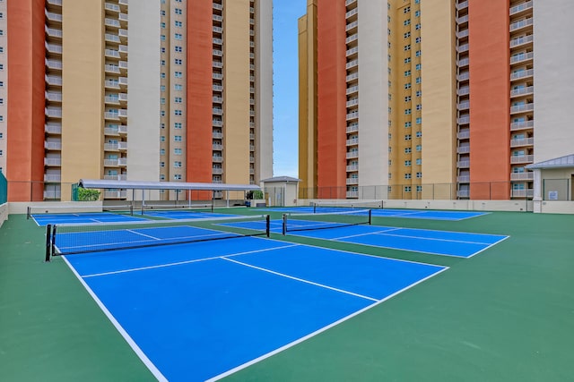 view of sport court featuring fence