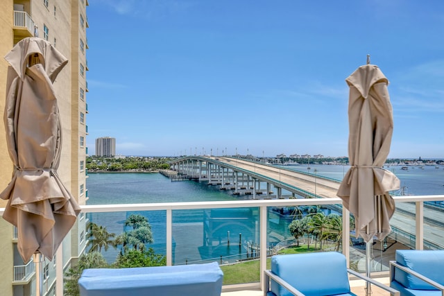 balcony featuring a view of city and a water view