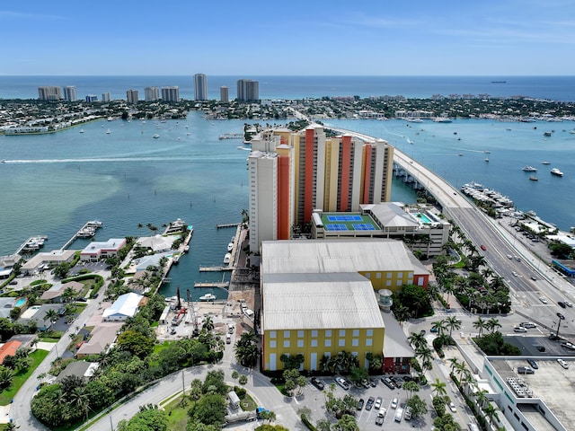 birds eye view of property featuring a view of city and a water view