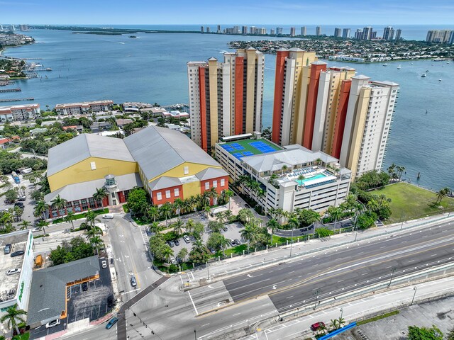 birds eye view of property with a city view and a water view