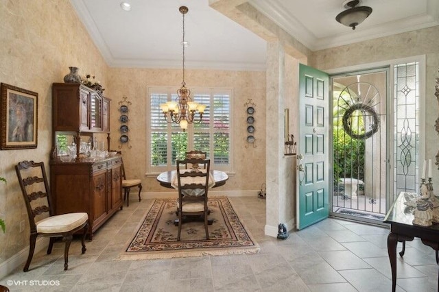 foyer entrance featuring light tile patterned floors, ornamental molding, and an inviting chandelier