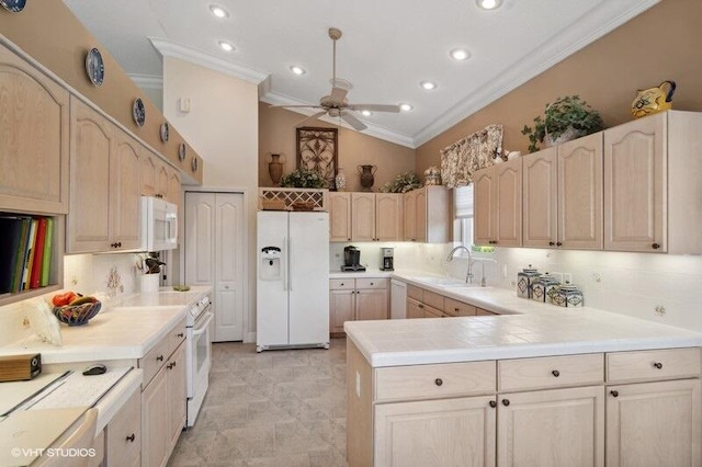 kitchen with white appliances, lofted ceiling, backsplash, ceiling fan, and sink