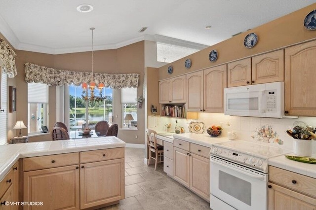 kitchen with light brown cabinets, white appliances, light tile patterned floors, decorative light fixtures, and tasteful backsplash