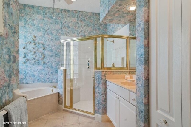 bathroom with tile patterned flooring, vanity, ceiling fan, and separate shower and tub