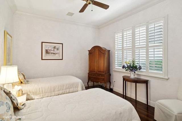 bedroom featuring ceiling fan, crown molding, and dark hardwood / wood-style floors