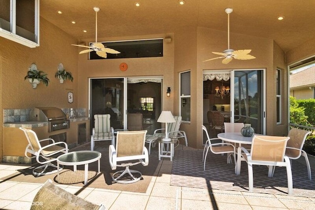 view of patio featuring ceiling fan, a grill, and area for grilling