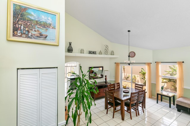 tiled dining area featuring high vaulted ceiling